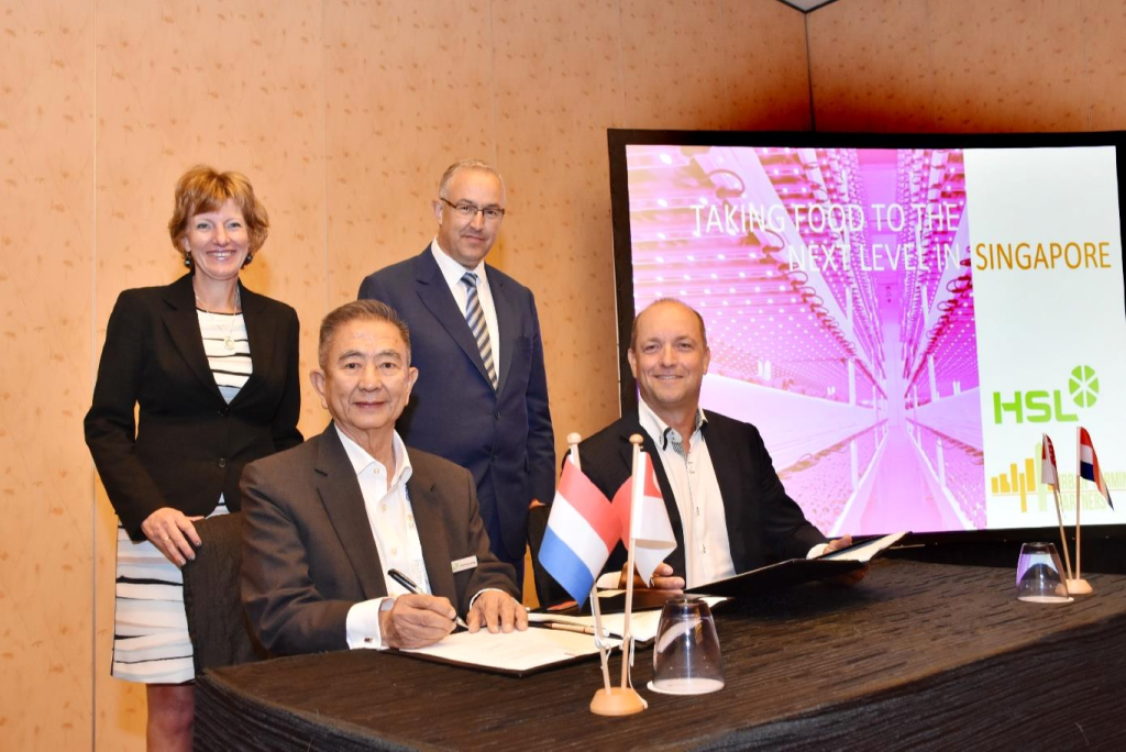 Contract signing by Mr Lim Choo Leng (chairman HSL) and Mr Wouter Vos (chairman Urban Farming Partners), under the watchful eye of Ms Margriet Vonno, Netherlands ambassador in Singapore, and Mr Ahmed Aboutaleb, mayor of Rotterdam. 